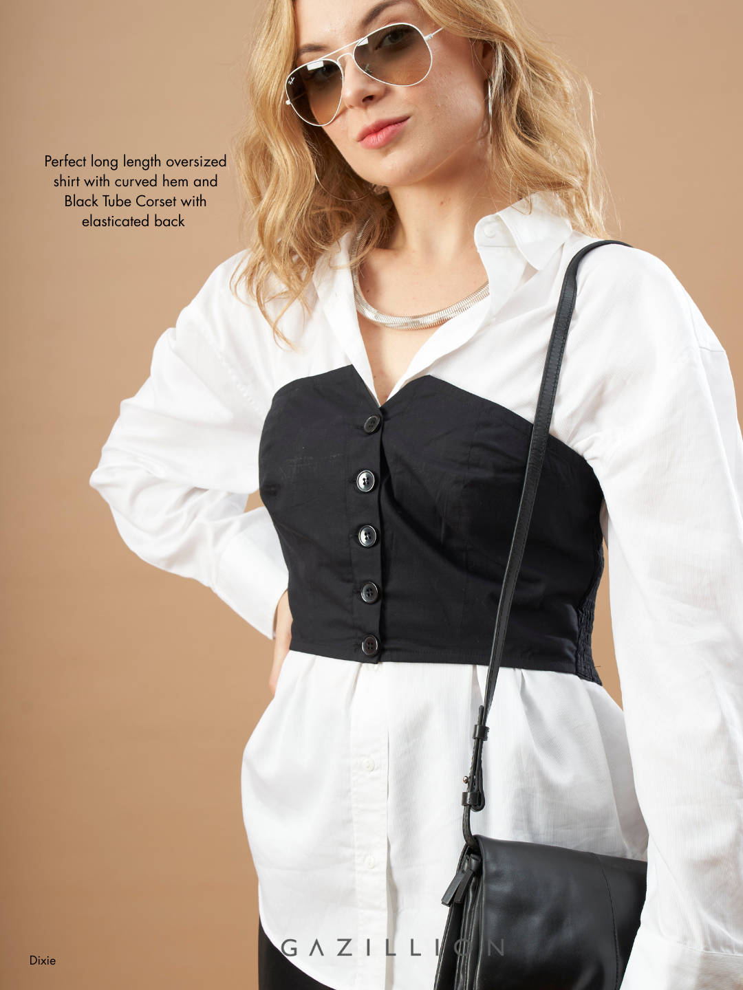 Woman wearing a white shirt with a black tube corset and sunglasses on a beige background