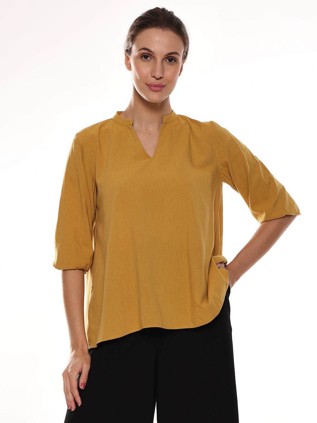 Girl wearing a mustard yellow easy breezy top in Florence Fit from Gazillion